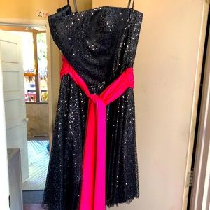 Black cocktail dress with hot pink sash